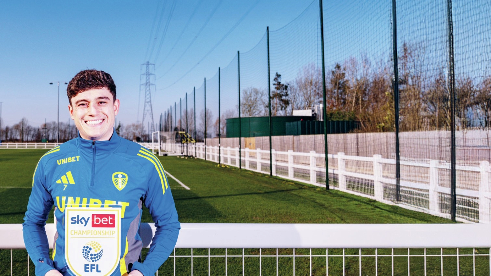 ALL-SMILES: Dan James shows off his trophy